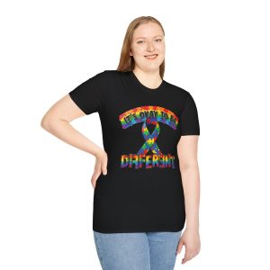 T‑shirt with multicolored puzzle‑piece ribbon and the phrase “It’s Okay to Be Different” in bold rainbow letters