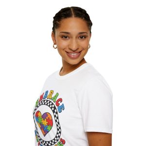 T‑shirt with a multicolored puzzle‑piece heart inside a checkered circle and the phrase “Embrace Differences”