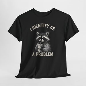 Funny raccoon “I Identify As A Problem” T‑shirt with cute illustrated raccoon holding a drink, sarcastic humor graphic tee